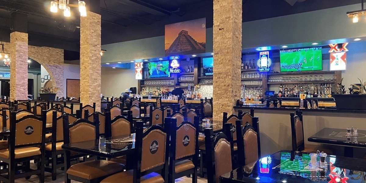interior of tulum bar and grill - view of seating and bar area. 